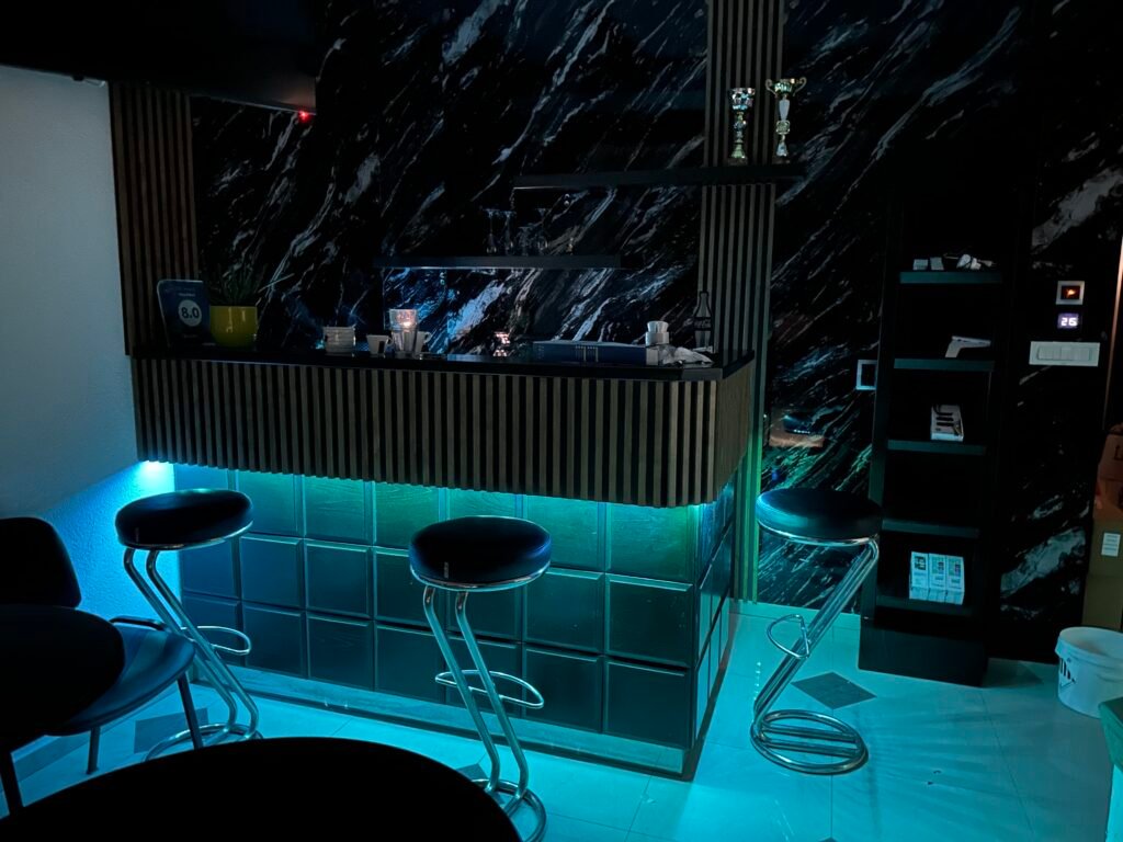 Villa Milka bar and seating area illuminated at night